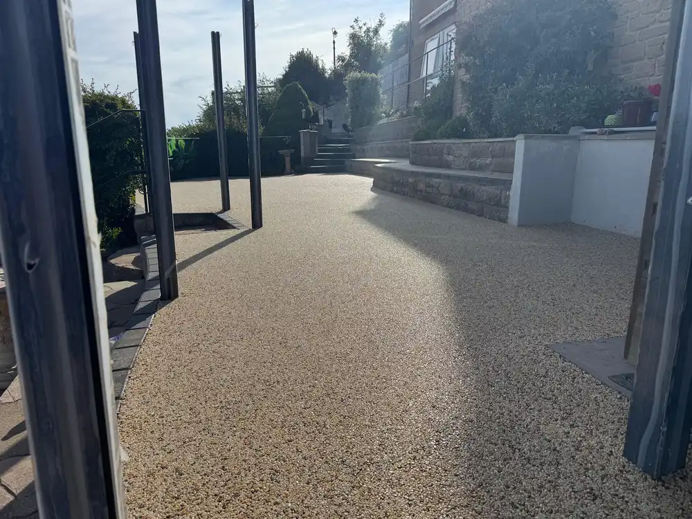 A buff resin bound patio and pathway at a coastal Bournemouth garden