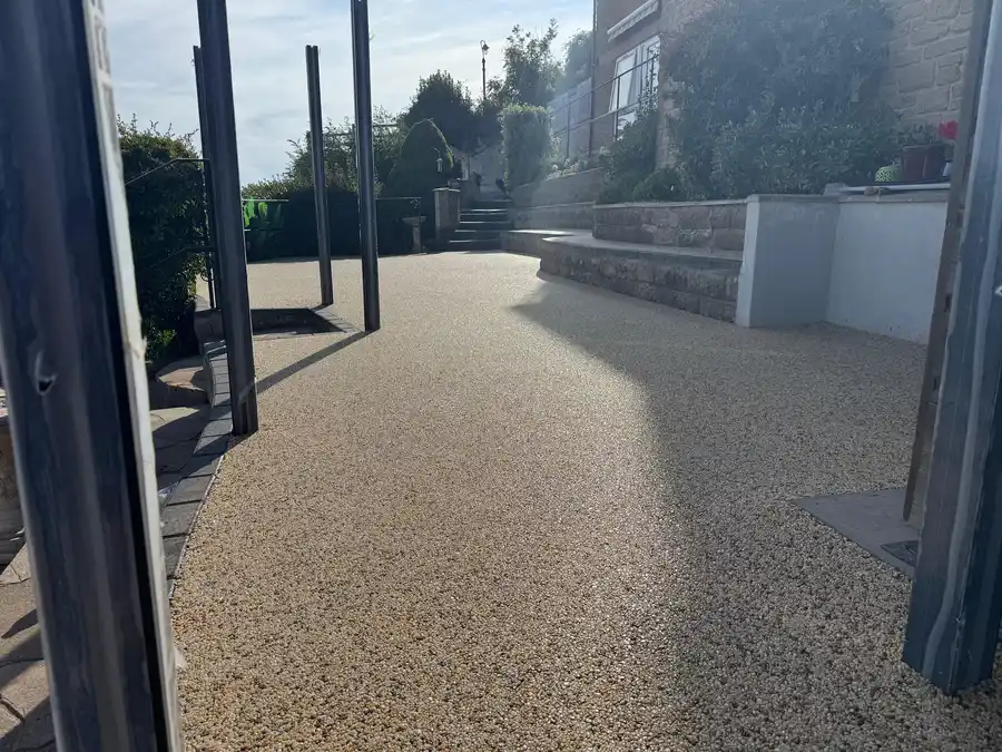 Buff resin bound patio seating area in a Bournemouth garden