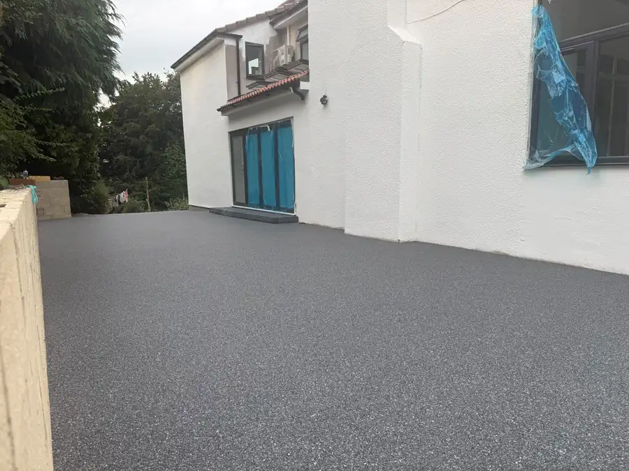 A charcoal resin bound driveway built to take a vehicle at a Bournemouth home