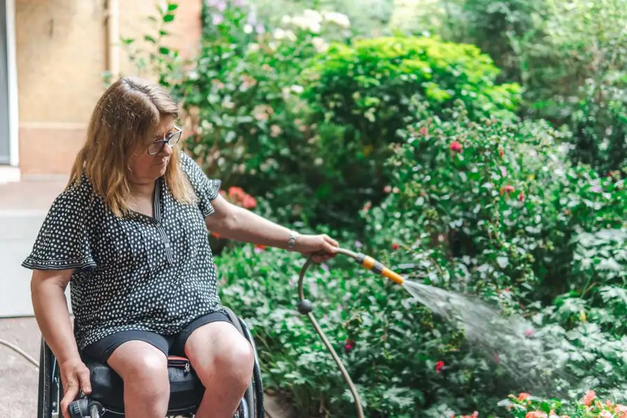 A wheelchair user on a firm outdoor path