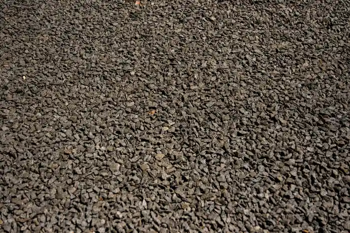 A textured resin bonded style surface showing the rougher scattered-stone finish