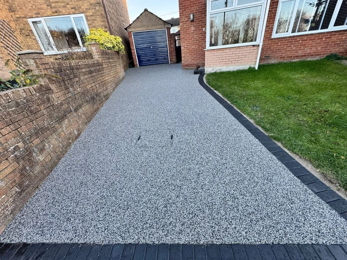 Silver grey resin bound driveway with charcoal border at a home in Bournemouth