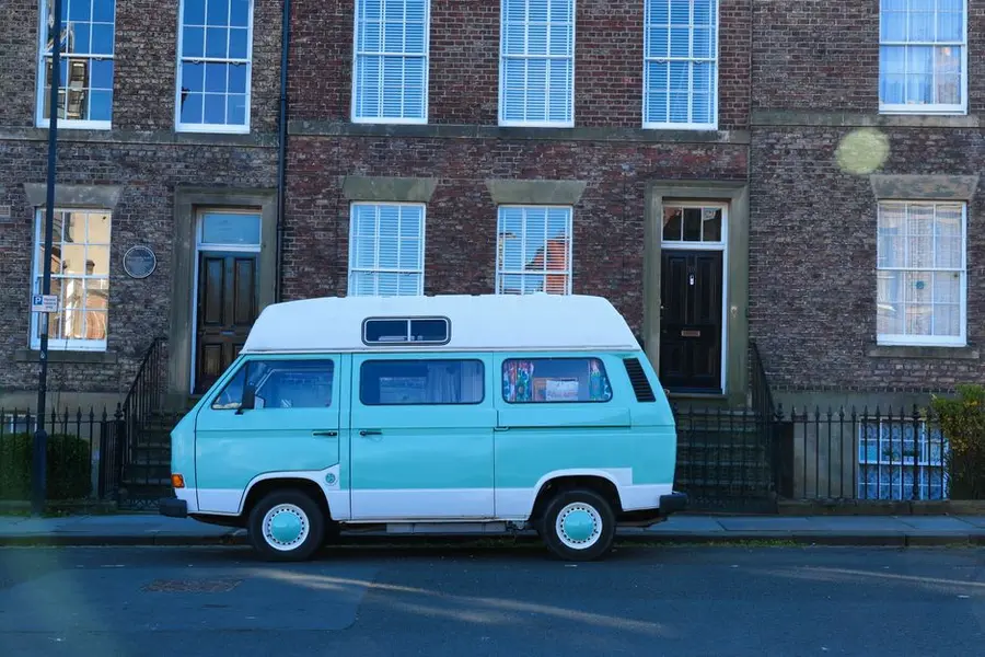 A large van parked on a driveway at a UK property
