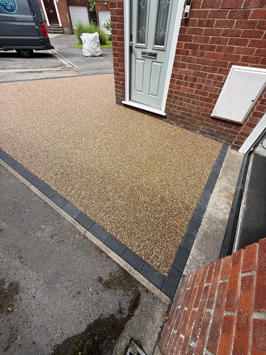 Buff resin bound driveway with front door at a Wareham property