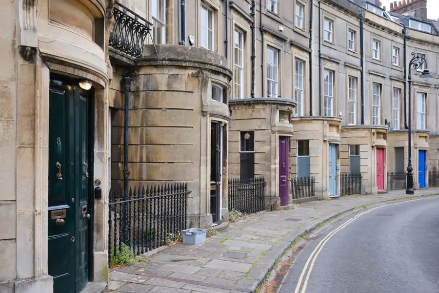 Terraced house with a front door and path - where a property is listed, any works that affect the character of the building or its curtilage may require listed building consent