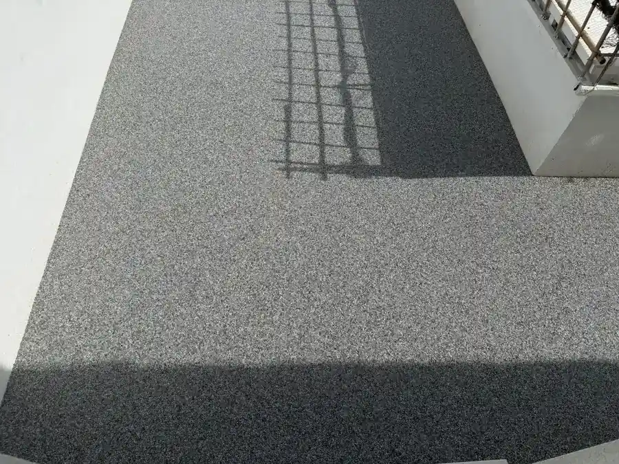 A resin bound driveway at a Bournemouth home showing the textured, grippy natural stone finish