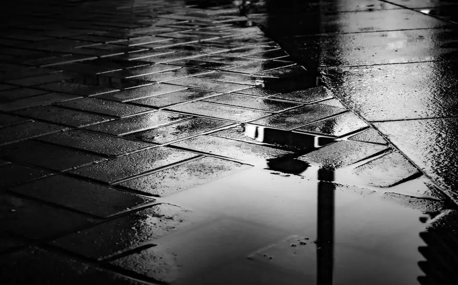 Rainwater soaking into permeable ground rather than running off