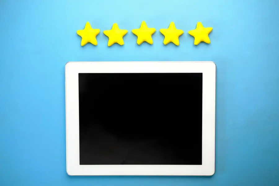 A person checking reviews on a phone - genuine local Google reviews are more reliable than website testimonials when assessing an installer