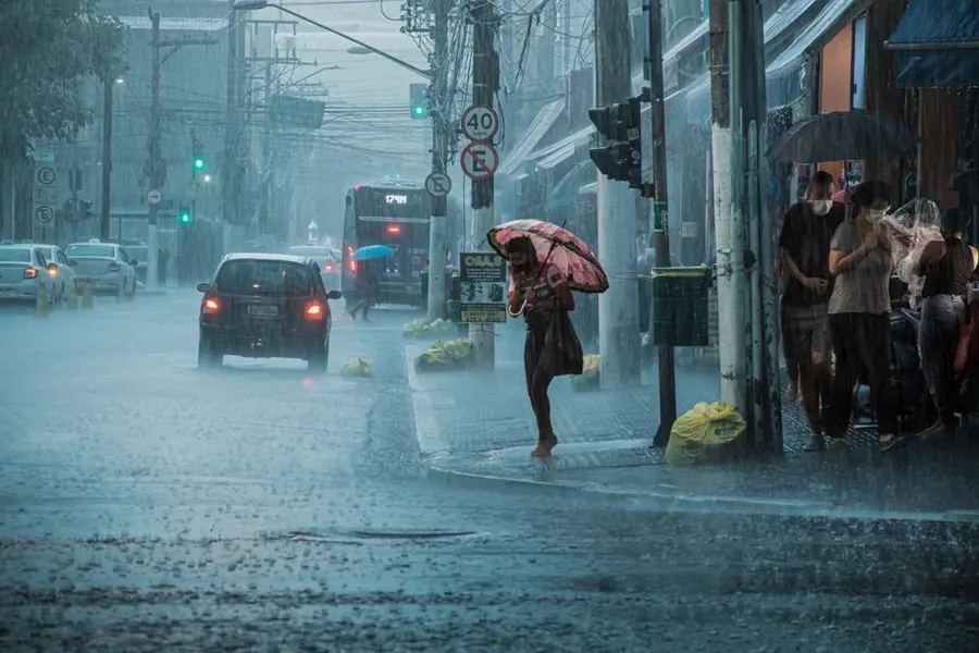 Heavy rain over a UK street, one of the things resin cannot be laid in