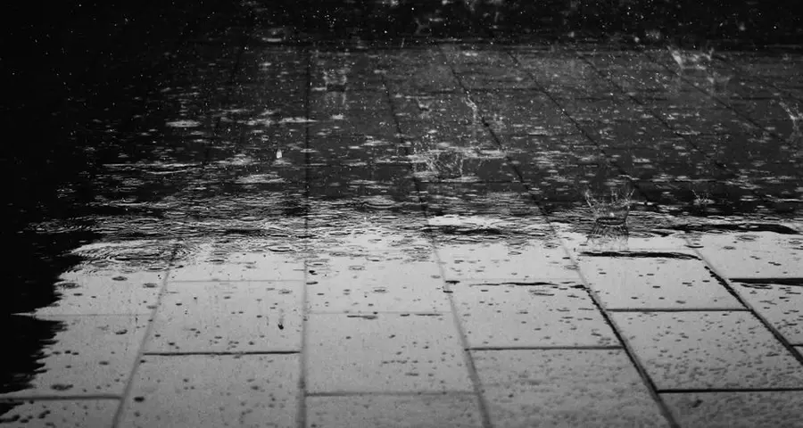 Rainwater on a driveway surface, draining rather than pooling