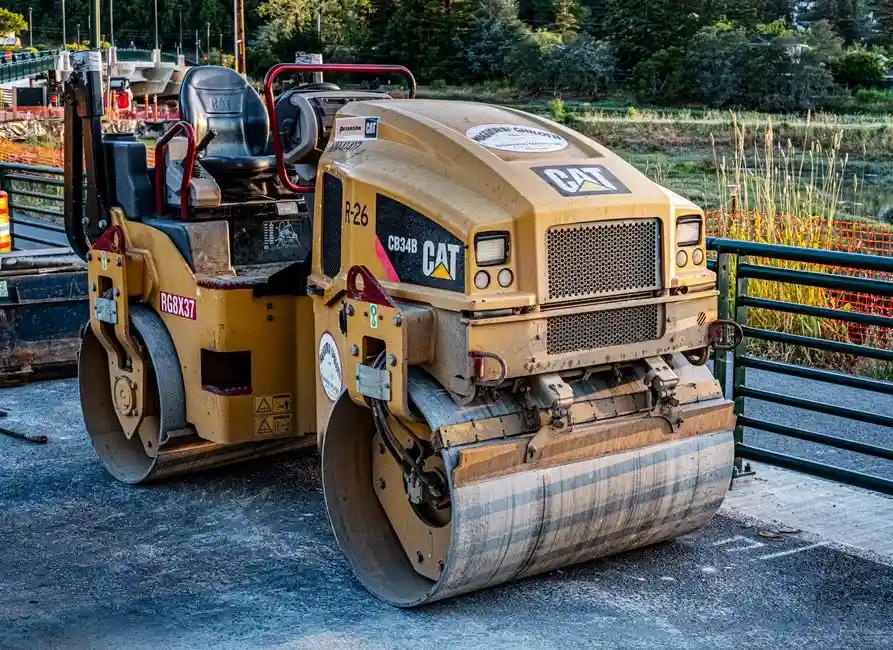 A plate compactor being used to prepare a sub-base