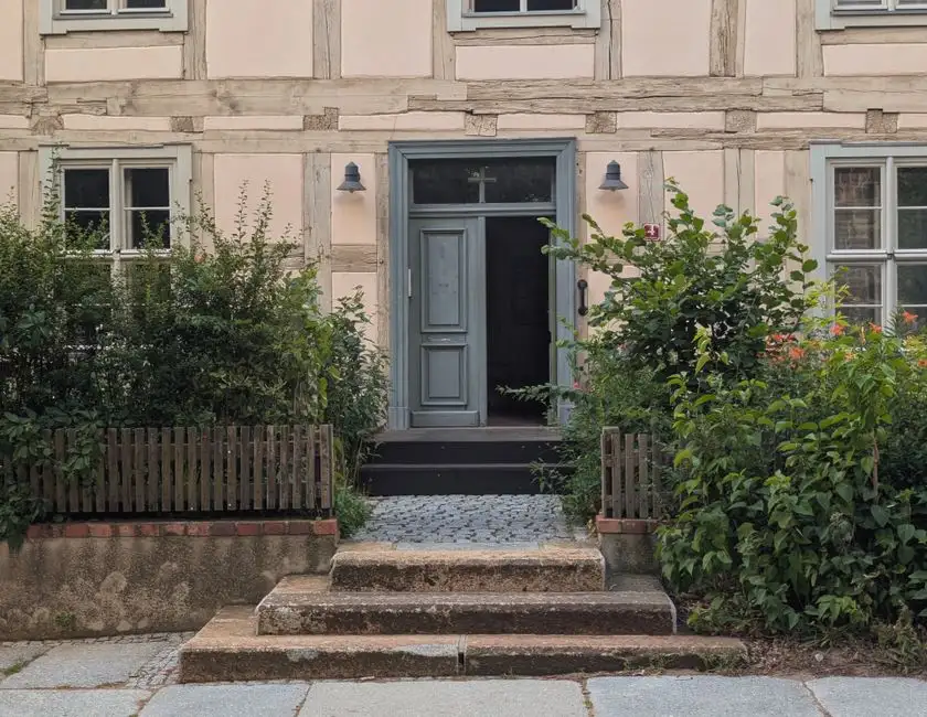A well-maintained front garden and driveway showing good kerb appeal - the long-term appearance of the surface is a factor in whole-life cost
