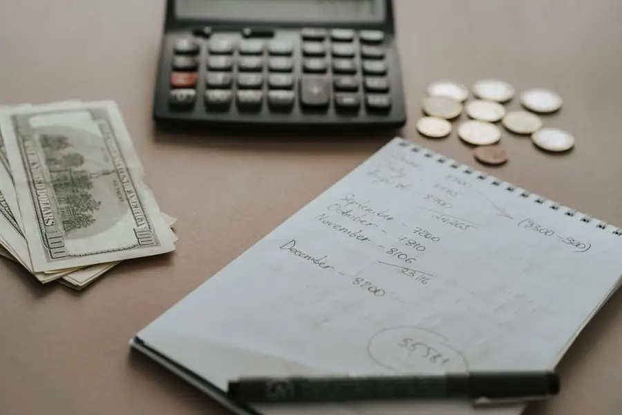 A calculator and household budgeting for a driveway decision